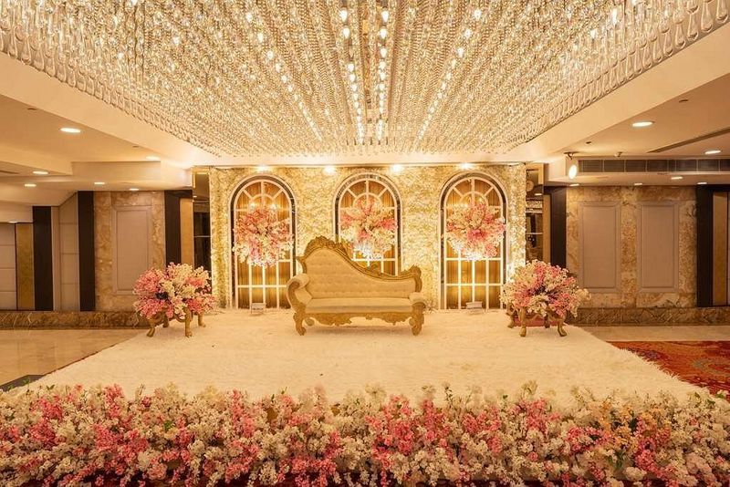 A beautifully styled reception stage designed to welcome the newlyweds
