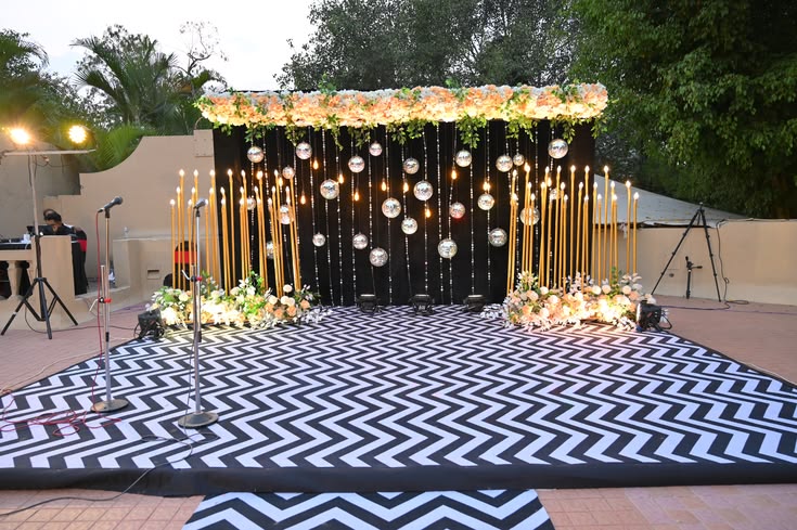 A beautifully styled Sangeet stage illuminated for an unforgettable evening